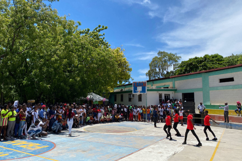 Young Haitians bond over sport, earrings and pineapple jam